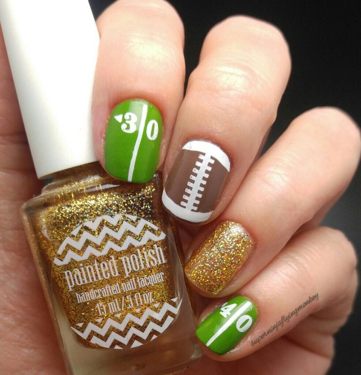 Vibrant Sport-Themed Nail Design Celebrating Athletic Spirit with Colorful Patterns and Sparkling Accents