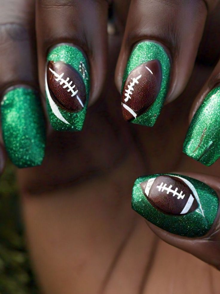 Vibrant Game Day Nail Art: Glittery Green Base with Playful Football Designs.