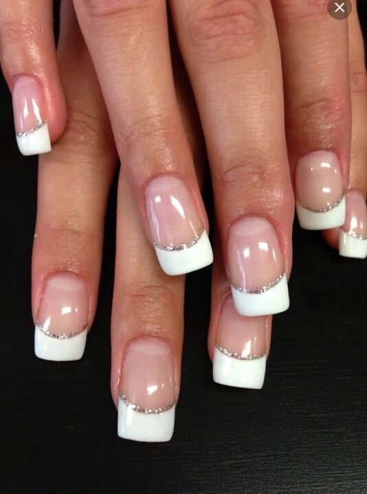 Chic French Manicure with Glamorous Silver Accents.