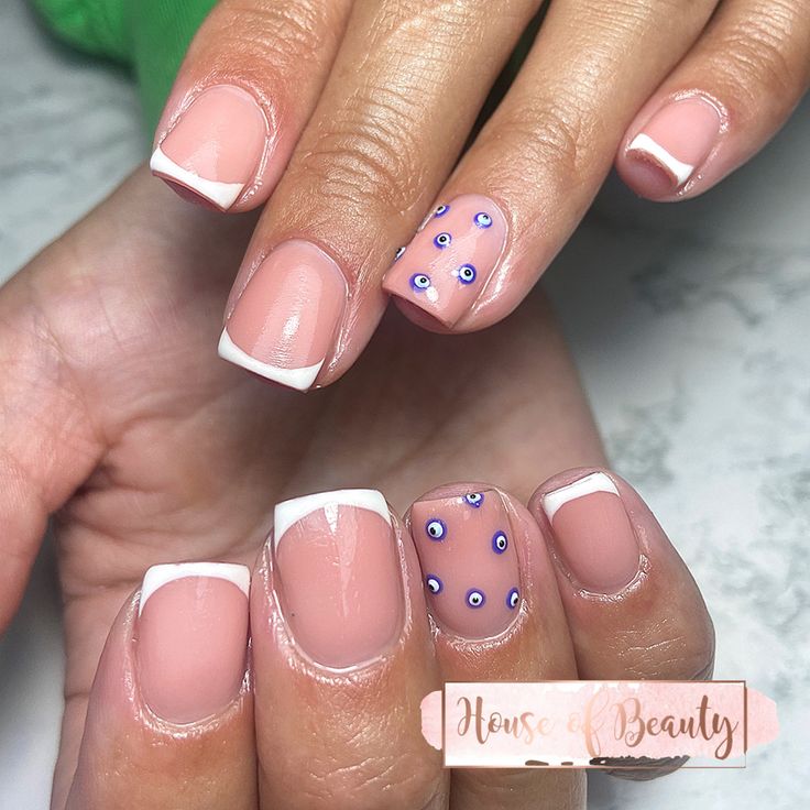 Chic French Tips with Whimsical Pastel Accents for Effortless Elegance.