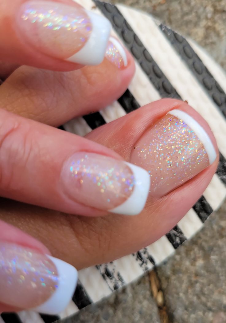 Elegant Ombre Nail Design with Iridescent Sparkles for a Polished Look.