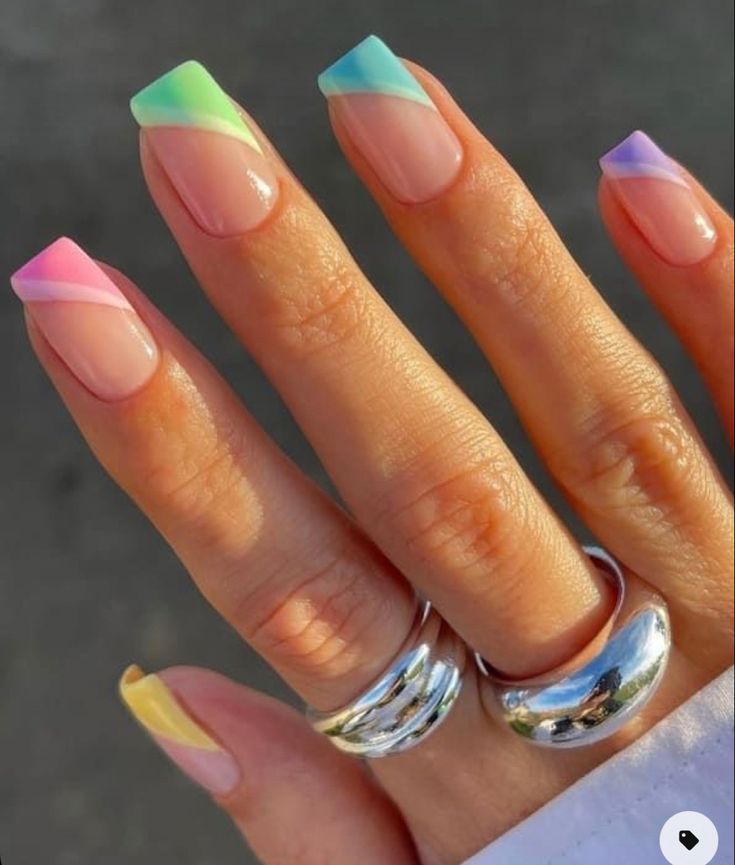 Pastel Ombre Geometric Nail Design with Bold Angular Tips for a Fresh Spring Aesthetic.