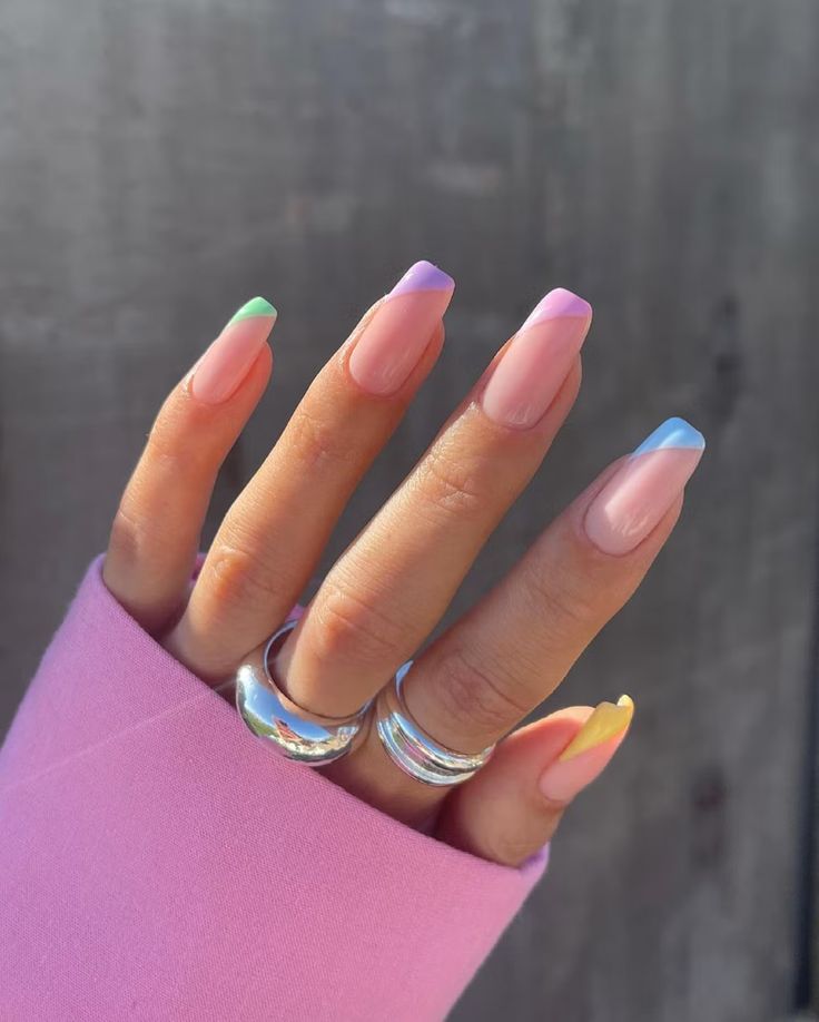 Chic Pastel French Tip Nail Design Accentuated by Minimalist Rings