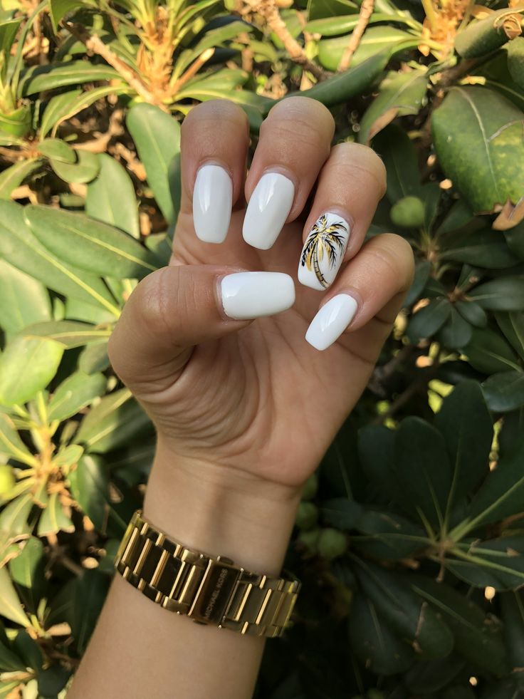 Chic Elegant White Nails with Glossy Finish and Tropical Palm Leaf Accent.