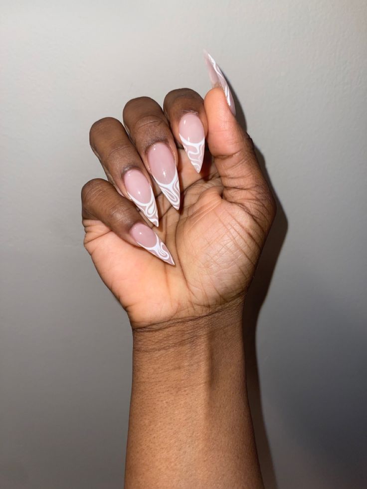 Sophisticated Almond-Shaped Nail Design with Soft Pink and White Accents.