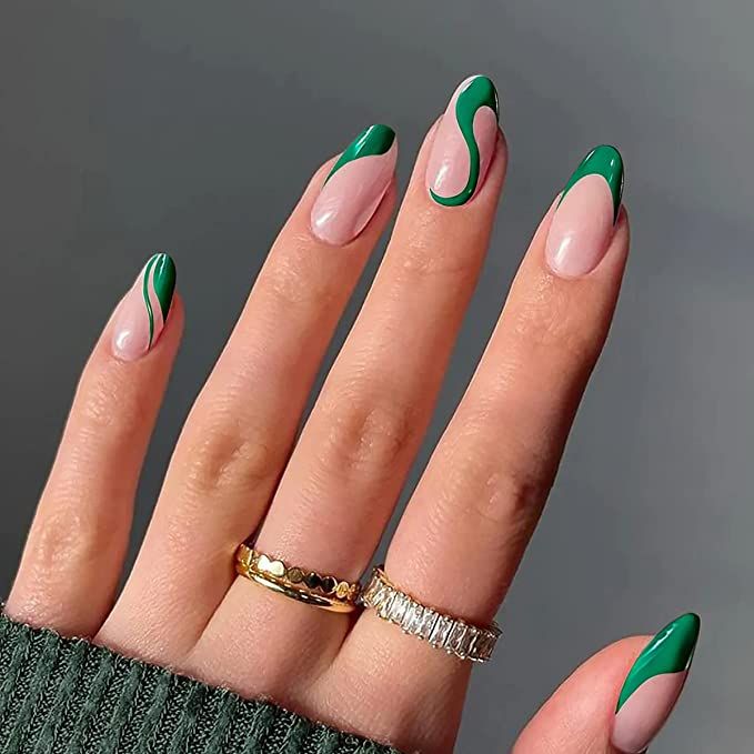 Chic Almond-Shaped Nail Design with Whimsical Green Swirls and Elegant Accents.