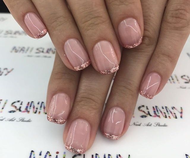 Elegant Rose Gold French Tips on Soft Nude Nails for a Chic Aesthetic.