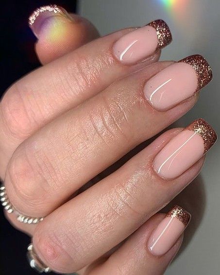 Chic Nude Nail Design with Glittering Rose Gold Tips for Versatile Elegance.