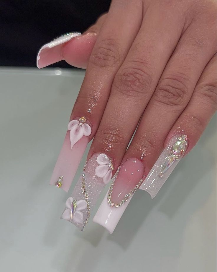 Elegant Floral Acrylic Nail Design with Rhinestones for a Glamorous Look.