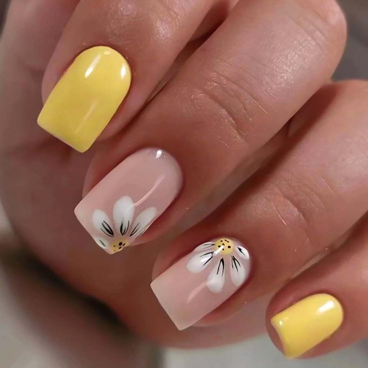 Charming Spring Nail Design: Playful Yellow and Nude Palette with Elegant Floral Accents.