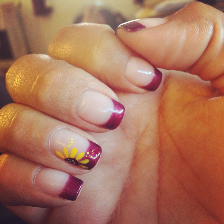 Chic Burgundy French Tip Manicure with Delicate Sunflower Accent