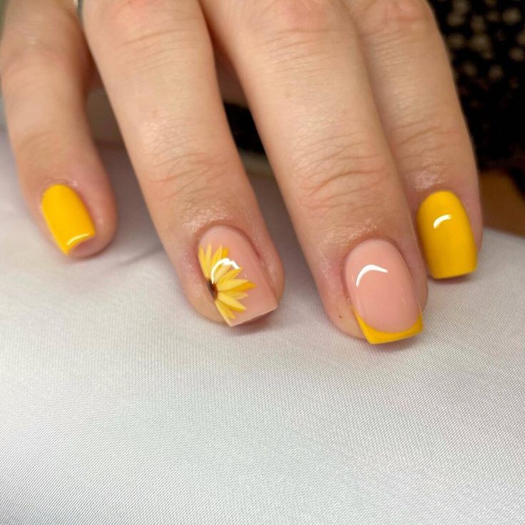 Cheerful Spring-Summer Nail Design: Vibrant Yellow with Pastel Peach Floral Accent