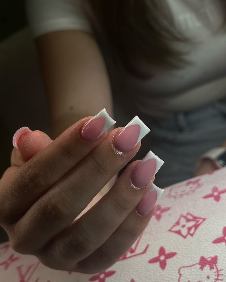 Chic Almond Gradient Nail Design: Soft Pink to Crisp White for a Modern French Manicure.