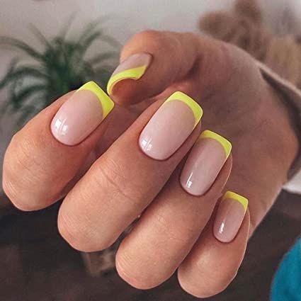 Chic Nude Base Manicure with Vibrant Neon Yellow Tips for a Fresh, Modern Look.