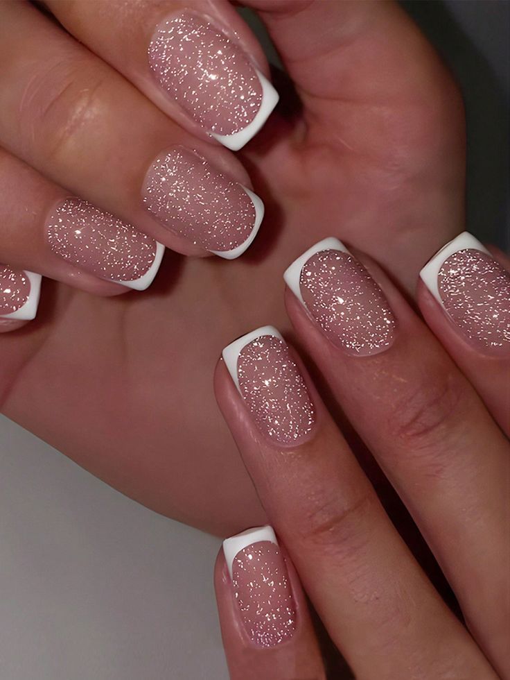 Sparkling Nude Nail Design with Classic White Tips: A Glamorous and Elegant Manicure for Any Occasion.