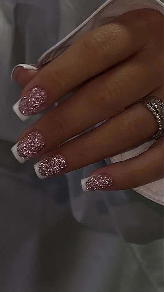 Elegant Sparkling Nail Design: Glossy White Tips with Contrasting Pink Glitter