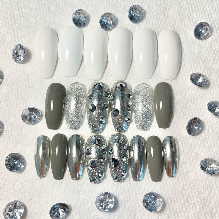 Sleek White and Gray Nail Design with Glamorous Finishes and Rhinestone Accents.