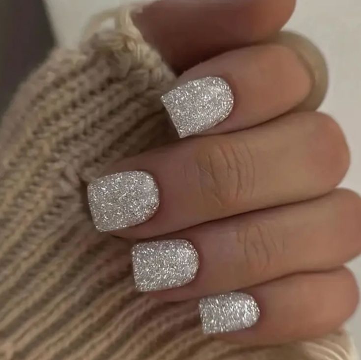 Chic Sparkling Silver Nail Design: Textured Elegance for Every Occasion.