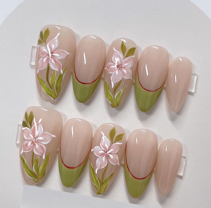 Elegant Floral Nail Design with Soft Pink Blossoms and Lush Green Leaves on a Nude Base.