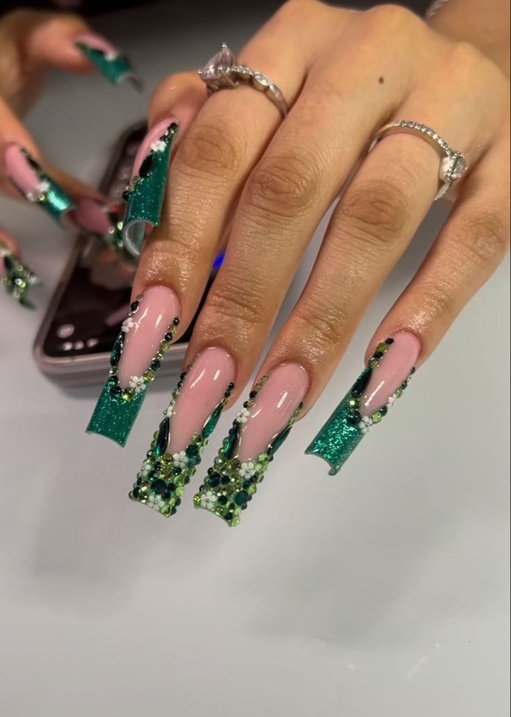 Elegant Emerald and Pink Nail Design with Sparkling Tips and Colorful Rhinestones.