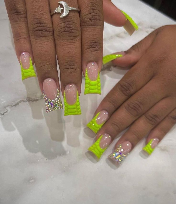 Bold Neon Green Nails Blend Textured Flair with Glossy and Reptilian Designs.