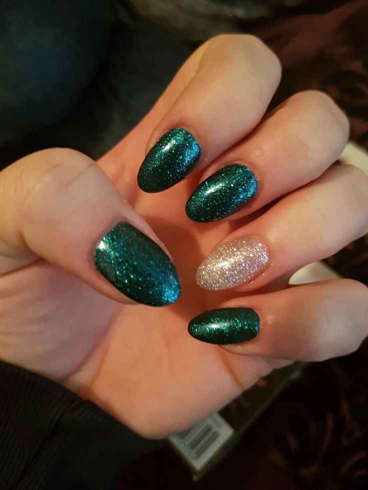 Teal and Silver Glitter Nail Design for a Glamorous Festive Look.