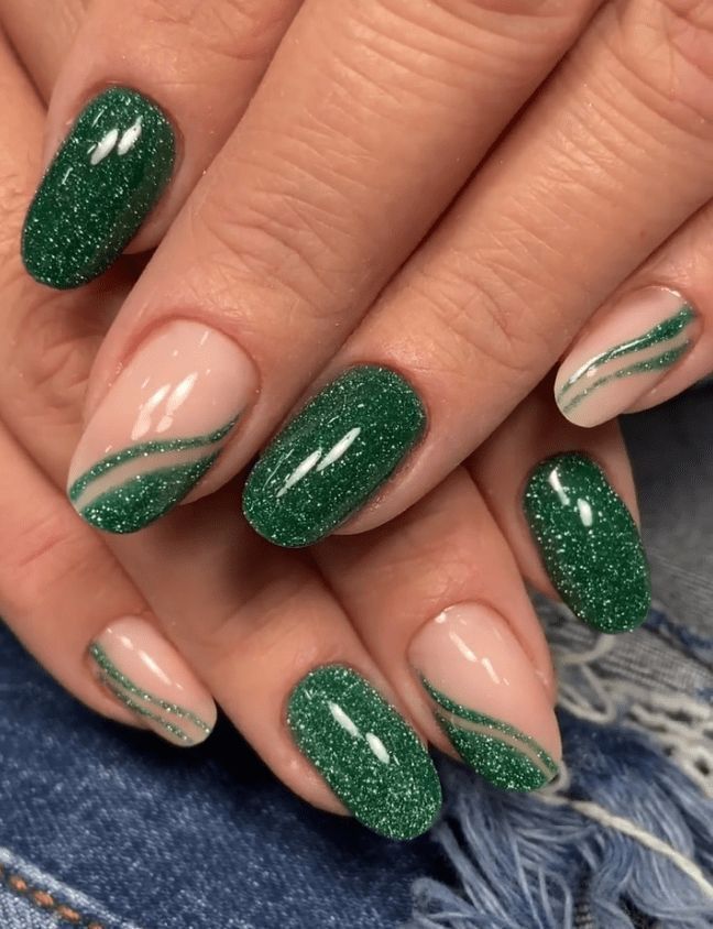 Elegant Sparkling Green Nail Design with Glitter, Swirls, and Deep Emerald Hues.