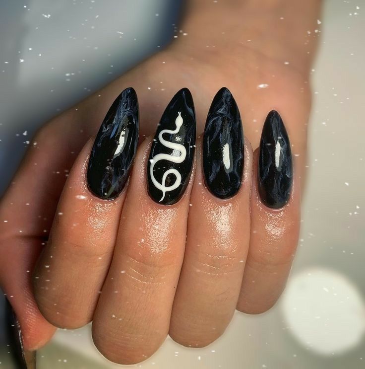 Sophisticated Black Almond Nails with Whimsical White Snake Design.