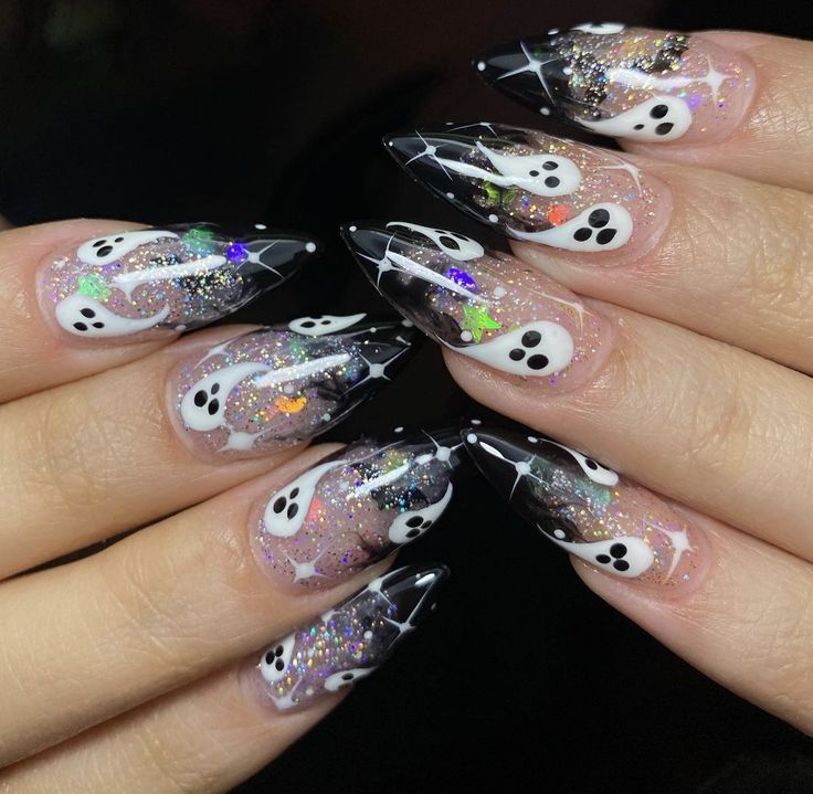 Hauntingly Festive Spooky Nail Design with Elongated Tips and Ghost Motifs