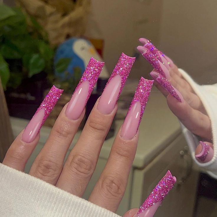 Glamorous Long Nails with Vibrant Pink and Glittery Design