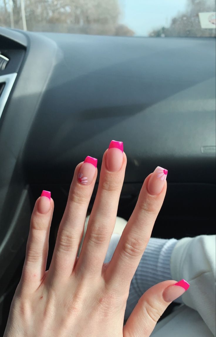 Elegant Vibrant Pink French Tips with Creative Accent Nail Designs.