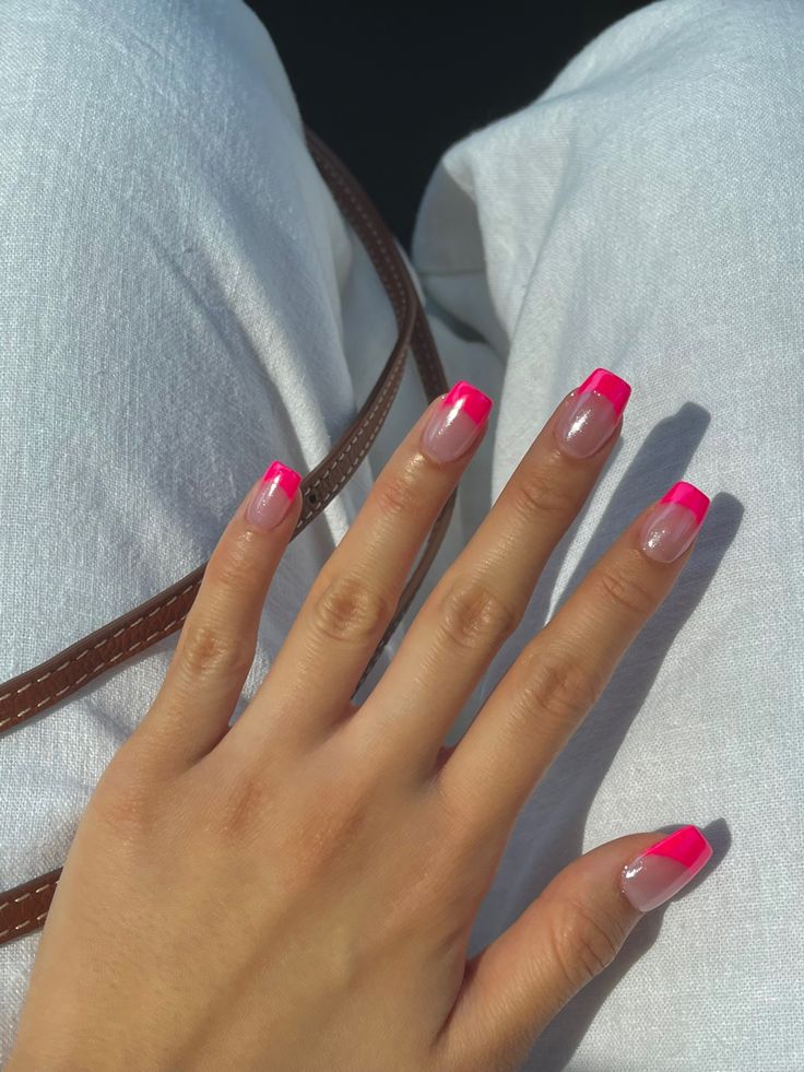 Vibrant Pink and Clear Nail Design with Bold Neon Tips for a Playful Summer Look.