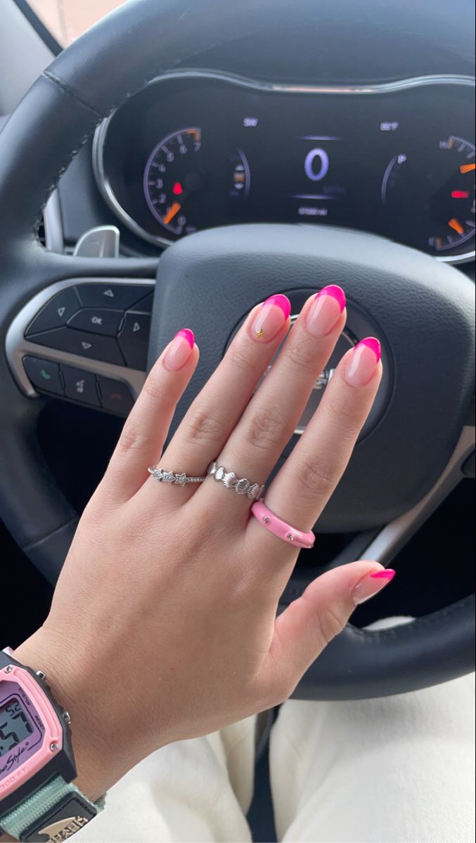 Bold and Playful Vibrant Pink French Tip Nails with Elegant Nude Base and Gold Accents