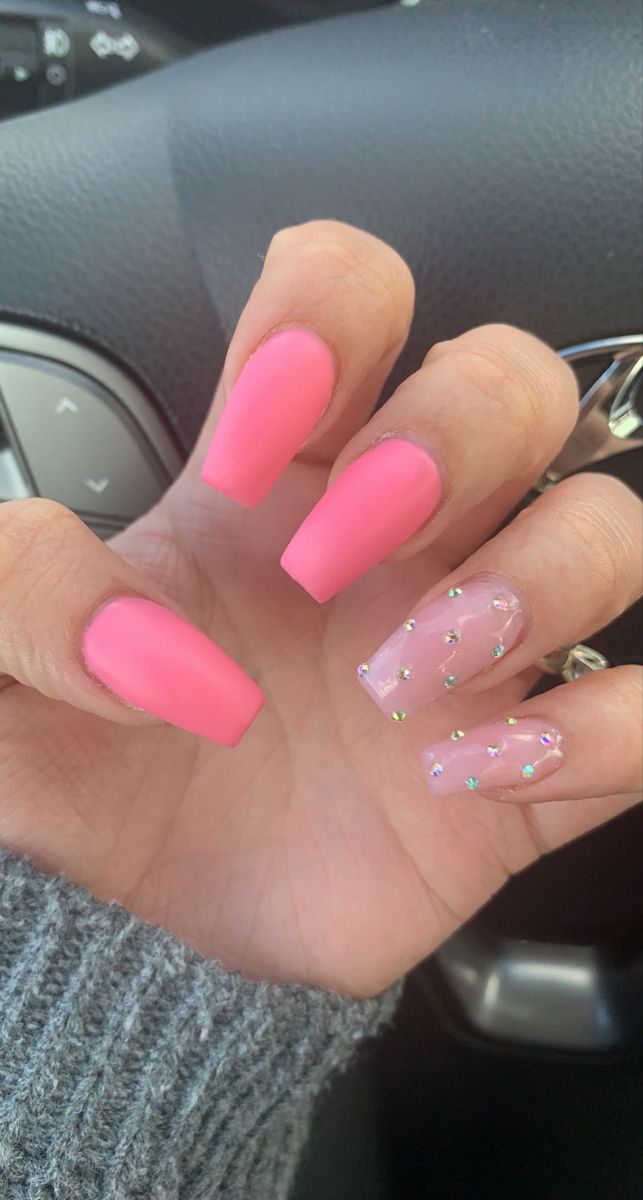 Bold Pink Matte Nails with Elegant Sparkling Accents for a Playful Yet Sophisticated Look.