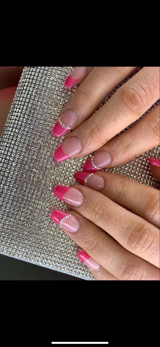 Elegant Chic Nail Design: Soft Pink and Vibrant Fuchsia French Tips with Rhinestones.