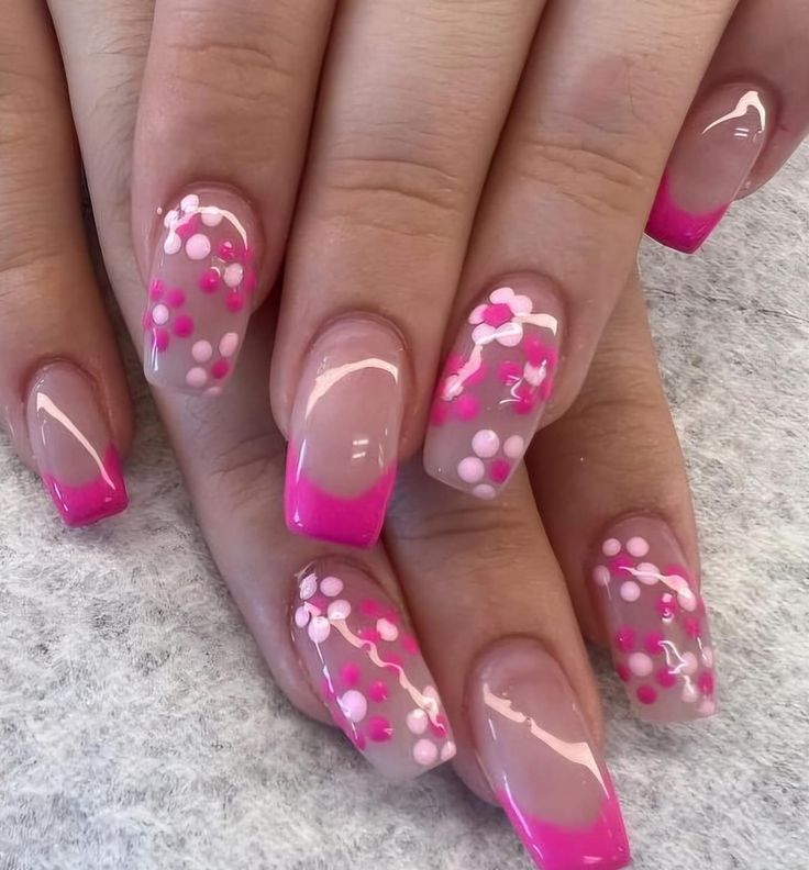 Charming Pink Floral Nail Design with Gradient Effect and Delicate Flower Details.