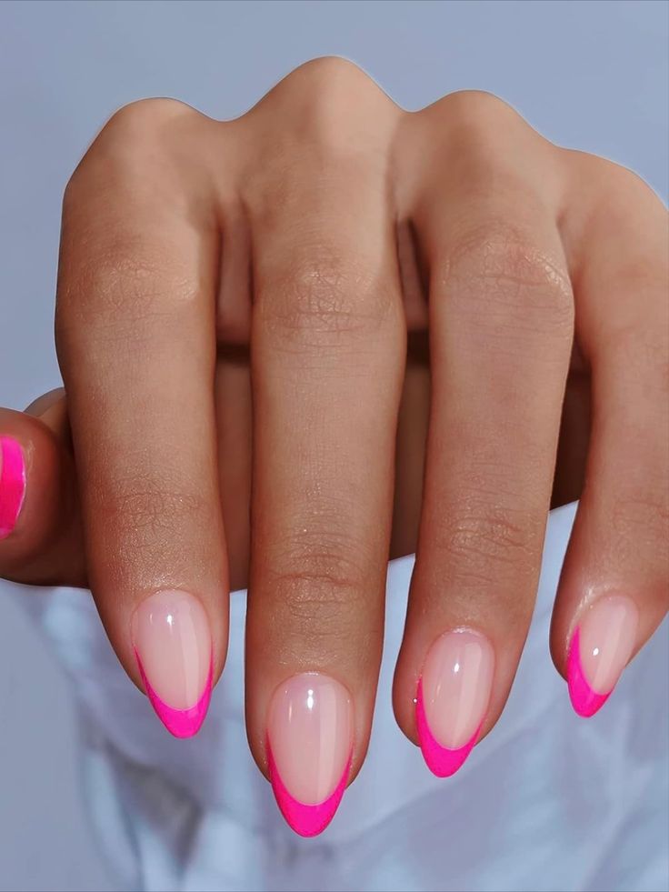 Chic Modern French Manicure: Vibrant Pink Tips on a Soft Nude Base for a Playful Look.