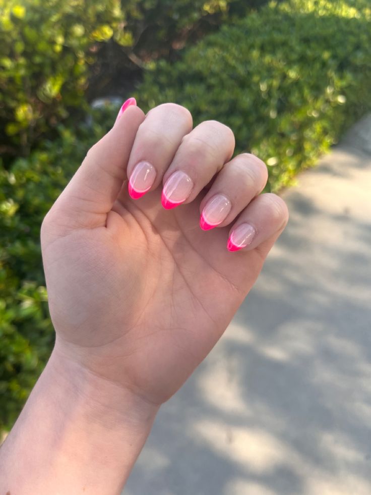 Modern Twist on Classic French Manicure with Neon Pink Accents.