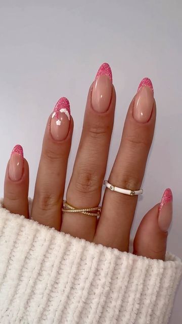 Chic Nude Nails with Vibrant Pink Glitter Tips and Whimsical White Accents