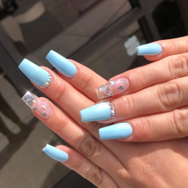 Chic Pastel Blue Nail Design with Glitter Accents and Rhinestones