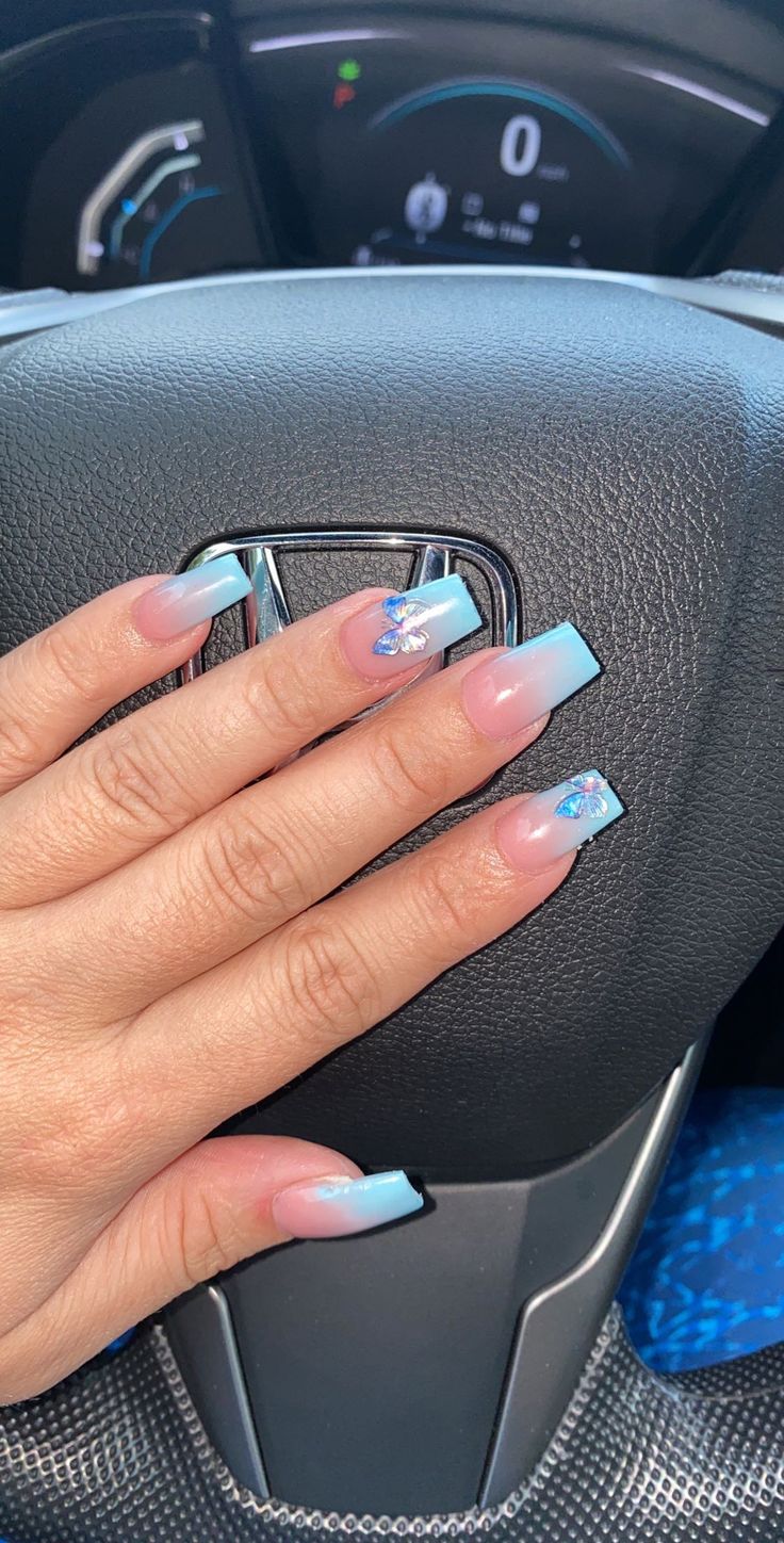 Elegant Pastel Nail Design with Ombre Effect and Intricate Art Accents