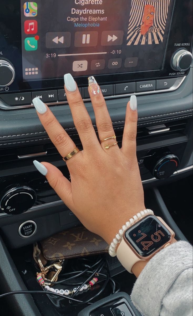 Chic Pastel Blue Almond Nails with Glam Accent and Trendy Accessories