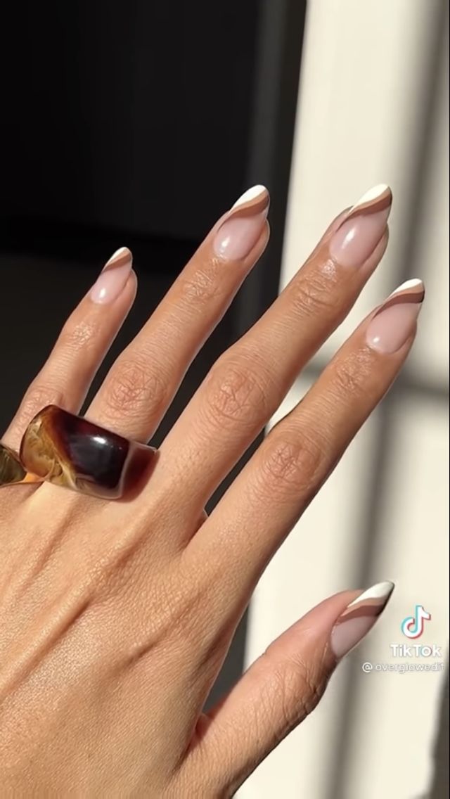 Chic French Tip Manicure with Bold Ring for Any Occasion