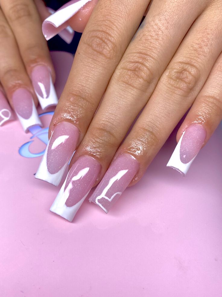 Chic Soft Pink and White Tapered Nail Design with Gradient and Intricate Accents.