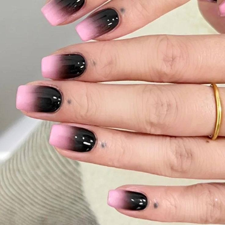 Bold Ombre Nail Design: Gradient Pink to Black with Glossy Finish.