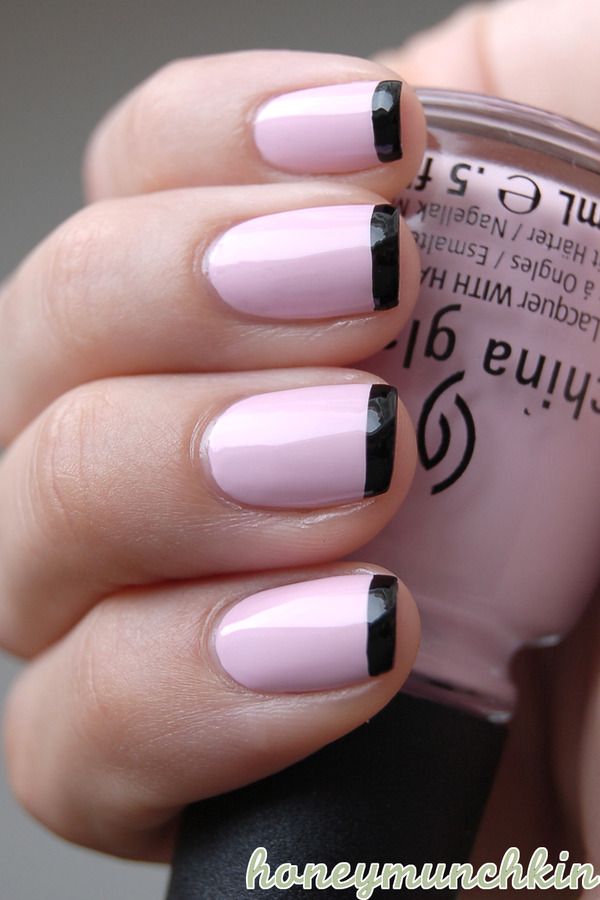 Chic Pastel Pink and Black Tip Nail Design: A Modern Twist on the Classic French Manicure.