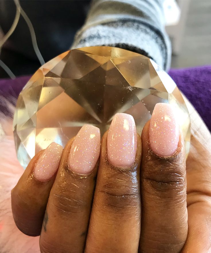 Sophisticated Elegant Nude Nail Design with Delicate Pink Sparkle