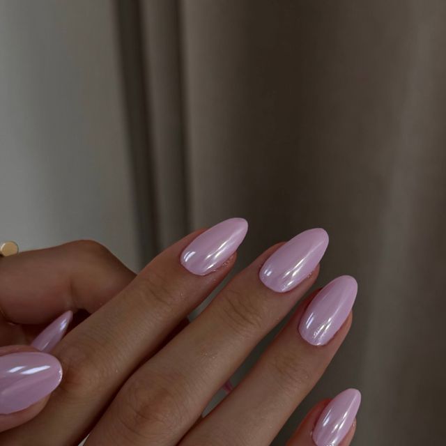 Elegant Pink Almond-Shaped Nails: Versatile Style for Any Occasion.