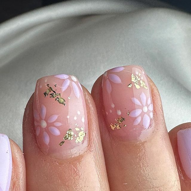 Elegant Pastel Floral Nail Design with Glamorous Gold Foil Accents.