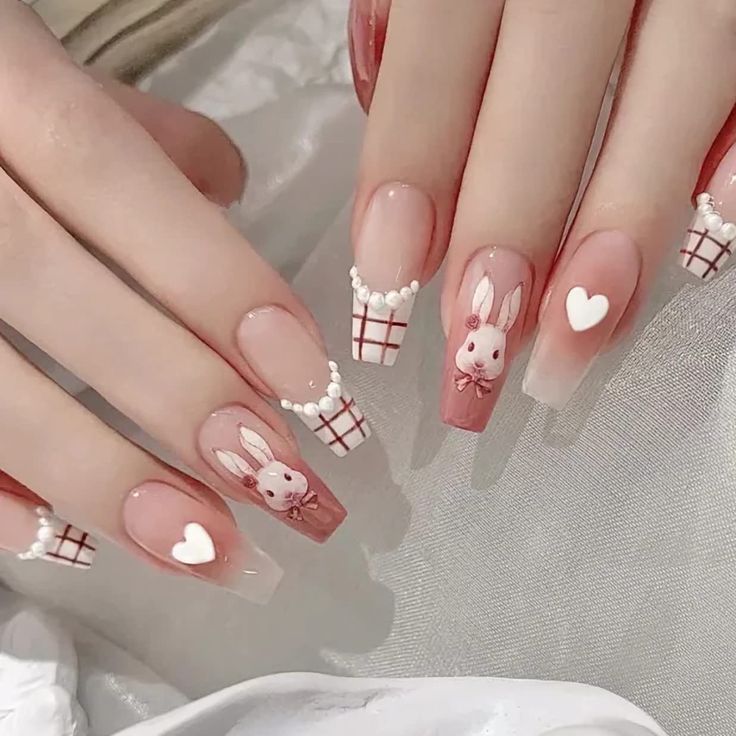 Charming Playful Nail Design with Bunny Motifs and Heart Accents